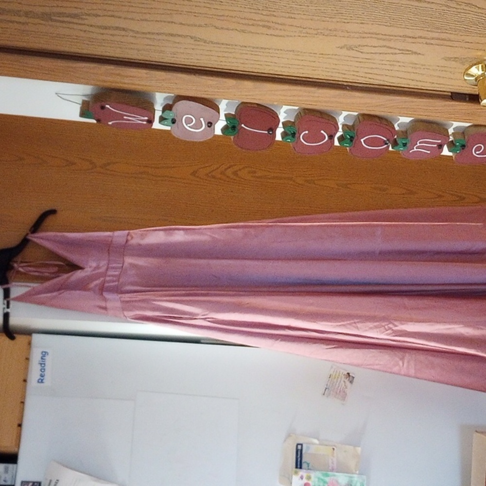 Spaghetti strap,open back, with pockets on both sides